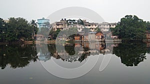 Landscape of city in reflection into the water.