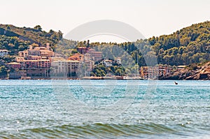 The landscape cityscape view of the Poggio Pertuso in the front of the Tenda Gialla beach in Province of Grosseto, Tuscany photo