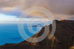 Landscape of cliffs of Mirador del RÃÂ­o and archipelago of Chinijo in background photo