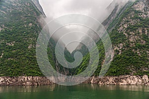 Landscape: Clouds descending along green slopes, Wu Gorge, Guandukou, China