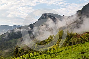 Landscape with clouds, jungles, mountains and crops Andes, Ecuador