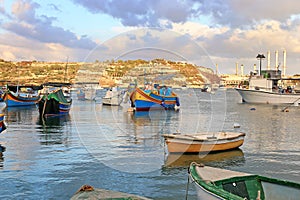 Landscape of colorful boats at Marsaxlokk village Malta