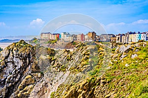 Landscape of colorful houses behind cliffs in Tenby a harbour town and resort in Pembrokeshire, southwest Wales, UK