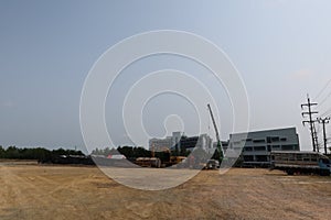 The landscape of the construction of new buildings in the industrial construction zone in Thailand is located outdoors.