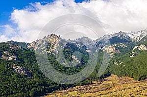 Landscape of Cuerda Larga mountain range with snow in the summits photo