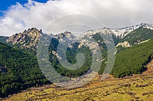 Landscape of Cuerda Larga mountain range with snow in the summits photo