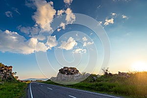 Landscape at dawn - mountains and empty road
