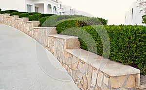 Landscape design. Nicely trimmed bushes at the front yard. Empty