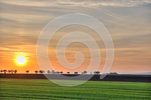 Landscape with distant road at sunrise photo