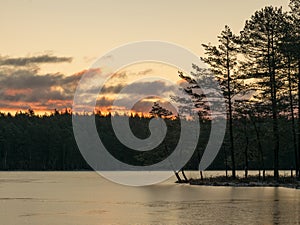 Landscape with early sunrise by the lake, heaven sky, black tree silhouettes