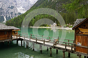 Landscape of the emerald smooth surface of Lago di Braies in the Dolomites, northern Italy, Europe