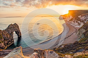 Landscape of empty Durdle Door beach at Sunset. Dorset England.