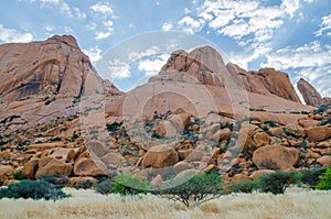 Landscape with famous red Spitzkoppe mountain and dramatic sky, Damaraland, Namibia, Southern Africa