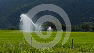 Landscape of a farm and field irrigation in Sel Norway