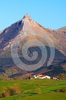 landscape of farms in Lazkaomendi in Gipuzkoa with Txindoki mountain