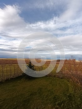 a landscape featuring fields and sky in southern Ontario
