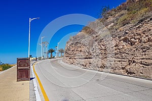 Landscape of Federal coastal highway 11 between promenade and arid rocky hillside