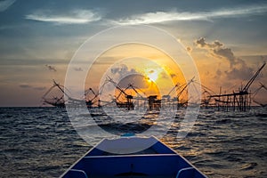 Landscape of fisherman`s village in Thailand with a number of fishing tools called photo