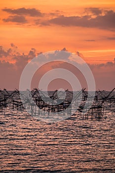 Landscape of fisherman`s village in Thailand with a number of fishing tools called photo