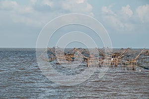 Landscape of fisherman`s village in Thailand with a number of fishing tools called photo