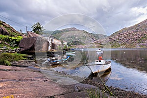 Landscape with fishing boats moored on shore. photo