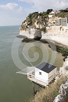 Landscape fishing cabin on a sea pier with a net at Talmon in the Gironde estuary in West coast of France