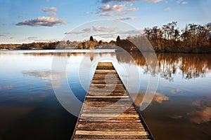 Landscape of fishing jetty on calm lake