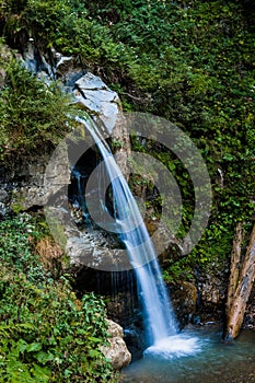 landscape flowing fresh cool blue water of waterfall in mountains