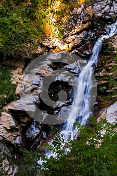 landscape flowing fresh cool blue water of waterfall in mountains