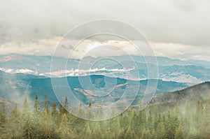 landscape forest and mountains in the mist silhouettes of peaks travel