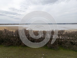 landscape of the Fuente de Piedra lagoon on a rainy, grey day, Andalusia