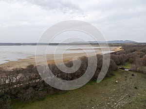 landscape of the Fuente de Piedra lagoon on a rainy, grey day, Andalusia