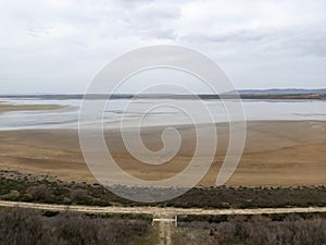 landscape of the Fuente de Piedra lagoon on a rainy, grey day, Andalusia