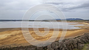 landscape of the Fuente de Piedra lagoon on a rainy, grey day, Andalusia