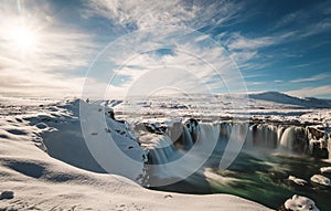 Landscape, Godafoss water fall at winter in Iceland with bright sunlight