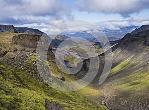 Landscape of Godland and thorsmork with rugged green moss covered rocks and hills, bending river canyon, Iceland, Fimmvorduhals