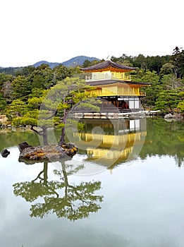 Landscape with the Golden Pavilion and reflections in the mirror surface of the reservoir