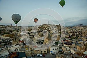 Landscape of Goreme at dawn. Hot air balloons over mountain landscape in Cappadocia, Goreme, Turkey. Aerial view from air balloon