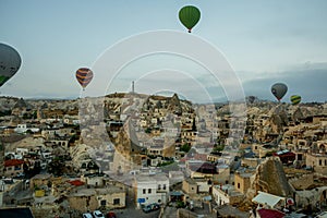 Landscape of Goreme at dawn. Hot air balloons over mountain landscape in Cappadocia, Goreme, Turkey. Aerial view from air balloon