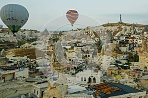 Landscape of Goreme at dawn. Hot air balloons over mountain landscape in Cappadocia, Goreme, Turkey. Aerial view from air balloon