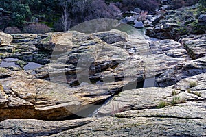 Landscape of granite rocks with dammed water. Stone texture. Atazar Madrid