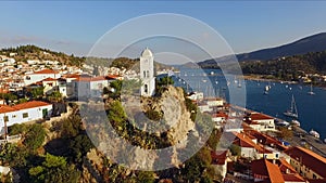 Landscape Greek island of Poros amidst the Mediterranean, with a bird`s-eye view, aerial video shooting, many moored to