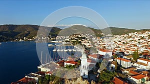 Landscape Greek island of Poros amidst the Mediterranean, with a bird`s-eye view, aerial video shooting, many moored to