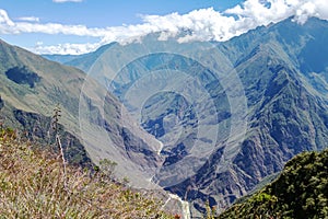 Landscape with green deep valley, Apurimac River canyon, Peruvian Andes mountains on Choquequirao trek in Peru