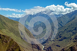 Landscape with green deep valley, Apurimac River canyon, Peruvian Andes mountains on Choquequirao trek in Peru