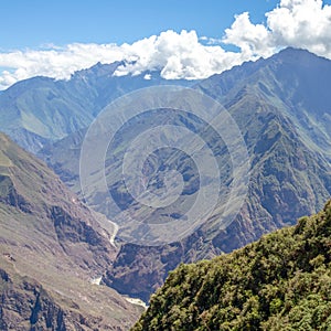 Landscape with green deep valley, Apurimac River canyon, Peruvian Andes mountains on Choquequirao trek in Peru