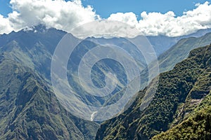 Landscape with green deep valley, Apurimac River canyon, Peruvian Andes mountains on Choquequirao trek in Peru photo