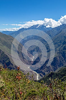 Landscape with green deep valley, Apurimac River canyon, Peruvian Andes mountains on Choquequirao trek in Peru photo