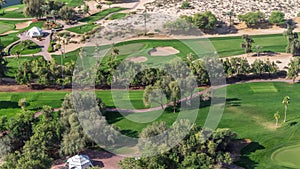 Landscape of green golf course with trees aerial timelapse. Dubai, UAE
