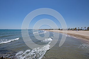 Landscape Gurugu Beach with Grao of Castellon in horizon photo